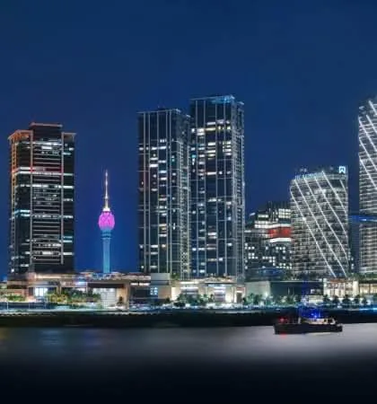 The Colombo skyline and Lotus Tower lit up at night across the water