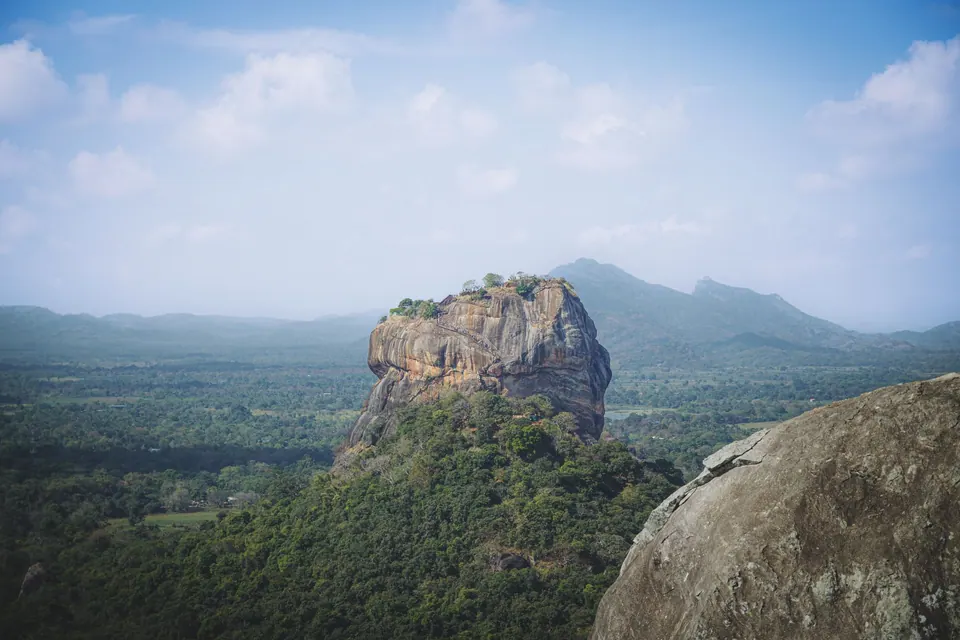 Sigiriya rock rising over the treetops of the Cultural Triangle