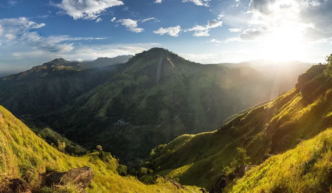 Sunrise over a green valley in Sri Lanka’s hill country