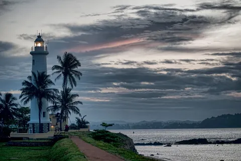 Galle lighthouse on the fort ramparts at dusk