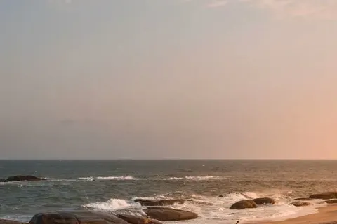 Golden sand and granite boulders on the east coast at sunset