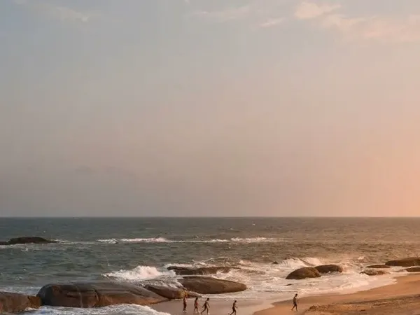 Golden sand and granite boulders on the east coast at sunset