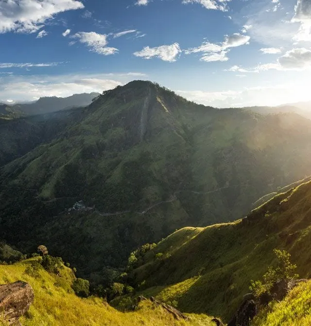 Sunrise over a green valley in Sri Lanka’s hill country