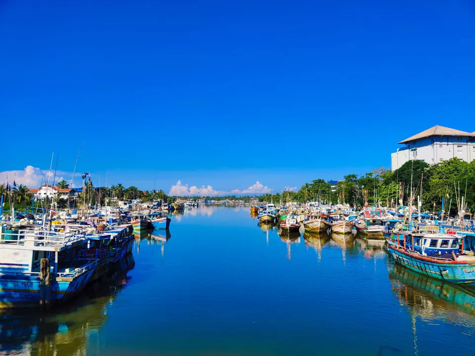 Colourful fishing boats moored along the Negombo lagoon canal